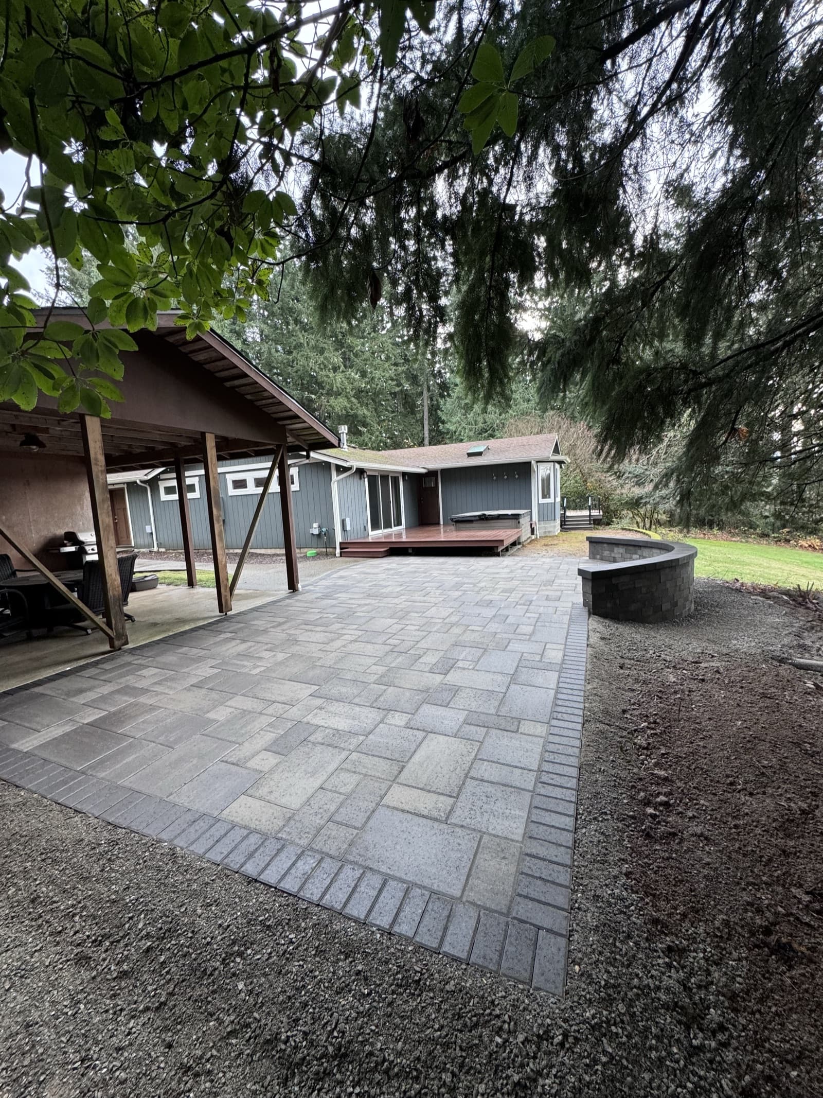 Natural stone patio with border detail and outdoor furniture