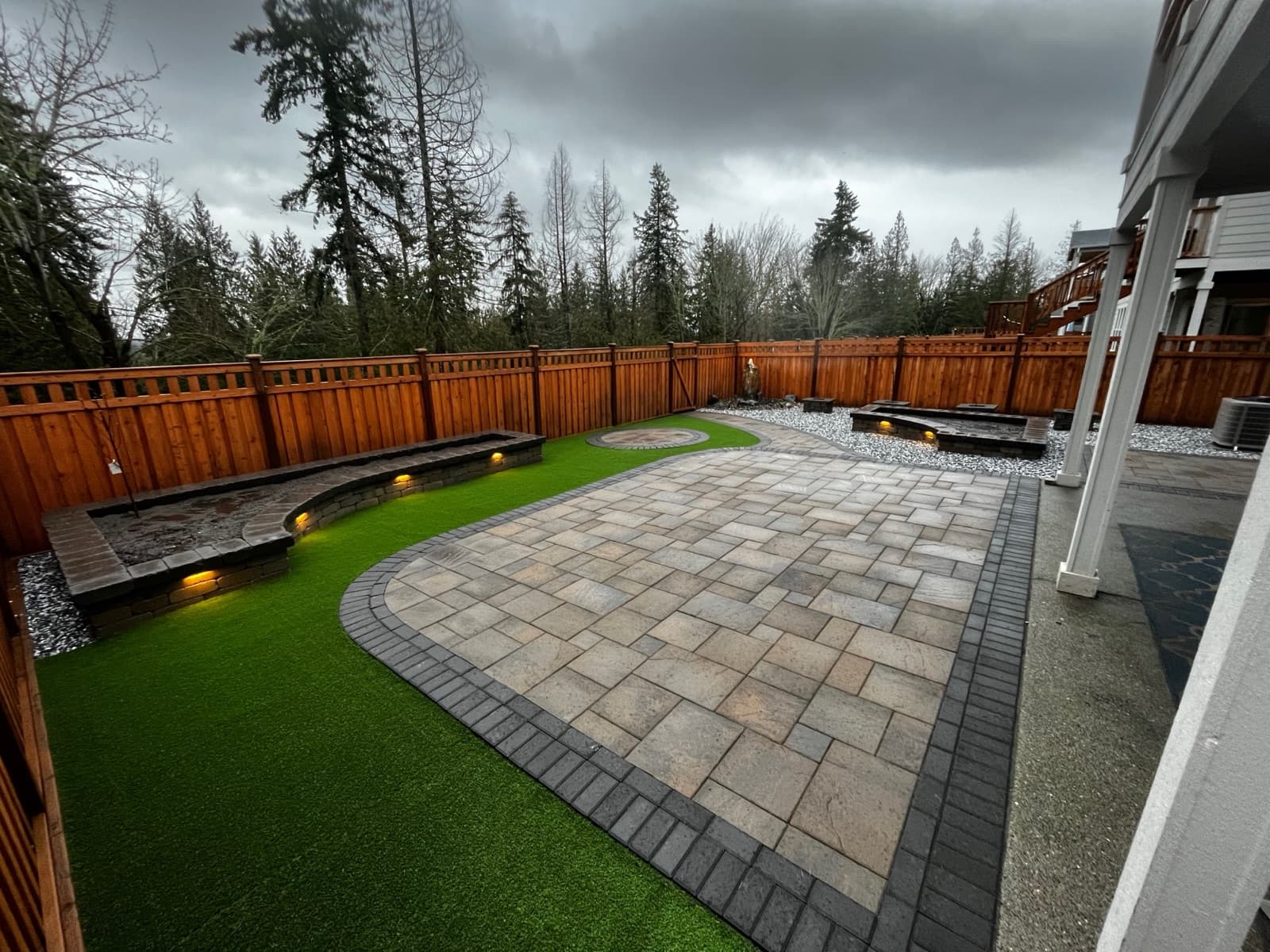 Stone retaining wall with terraced garden beds