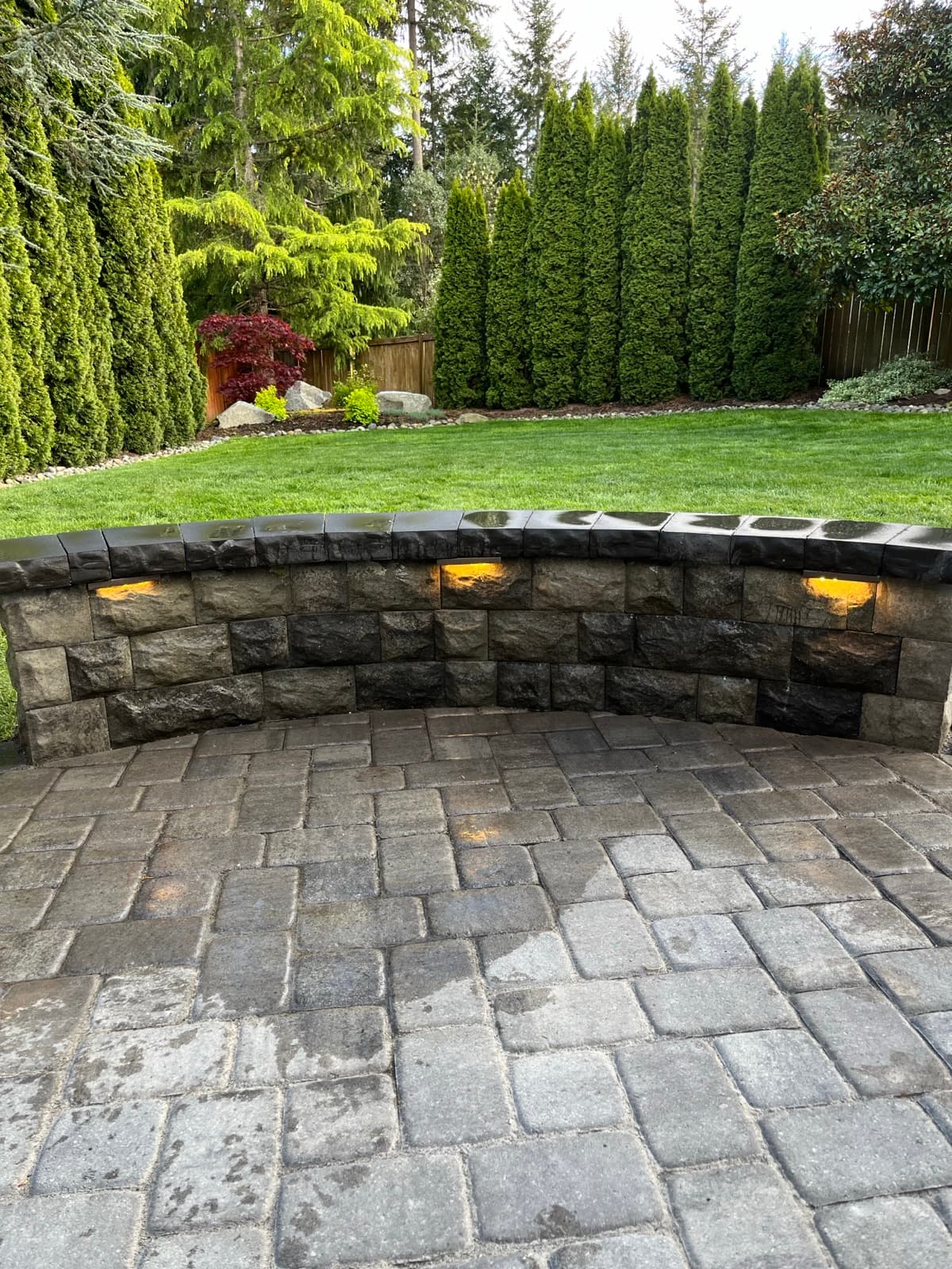 Retaining wall and stone staircase on steep residential lot