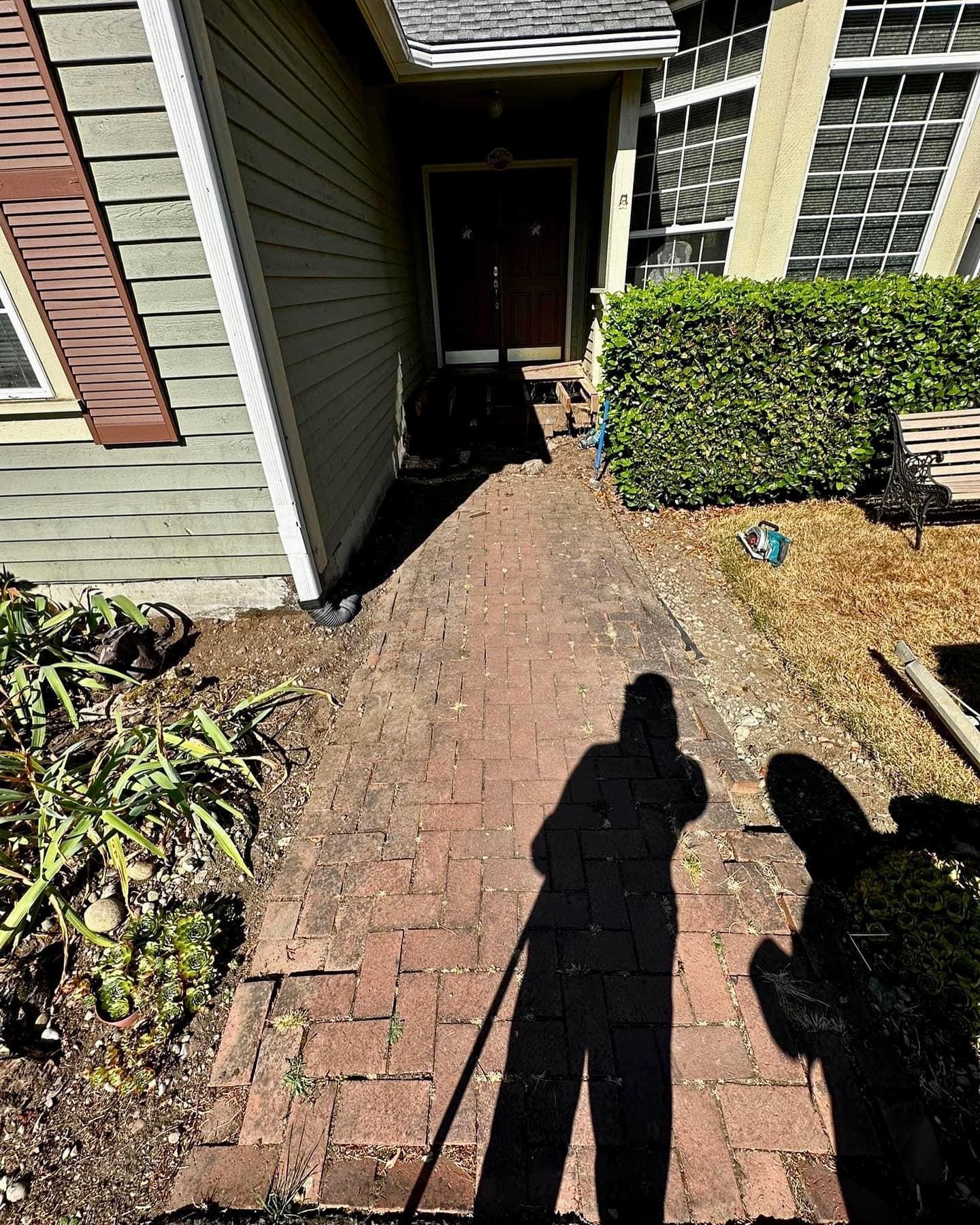 Brick paver walkway with running bond pattern and landscape edging